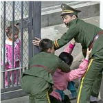 North Korean defector prevented by Chinese guards from entering the Japanese Consulate in Shenyang (2002)